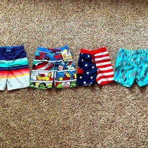 Boys swim trunks size 5-6. The super hero pair are new with tags